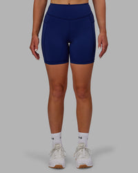 Woman wearing Elite High-Rise 6" Short Pockets - Midnight Blue