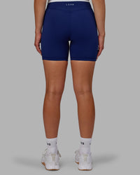 Woman wearing Elite High-Rise 6" Short Pockets - Midnight Blue
