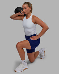 Woman wearing Elite High-Rise 6" Short Pockets - Midnight Blue