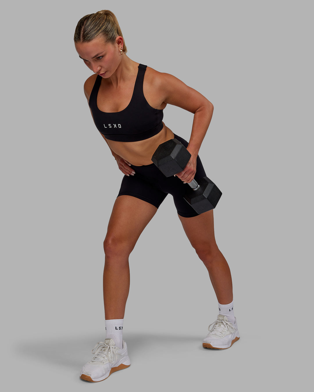 Woman wearing Elite High-Rise 4&quot; Short Pockets - Black
