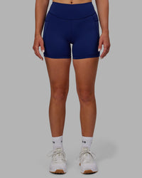 Woman wearing Elite High-Rise 4" Short Pockets - Midnight Blue