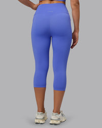 Woman wearing Elixir Ultra High-Rise 3/4 Legging Pockets - Baja Blue | Model:Sophie | Size:S