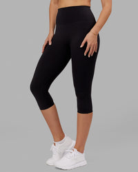 Woman wearing Elixir Ultra High-Rise 3/4 Legging - Black | Model:Chelsea | Size:S