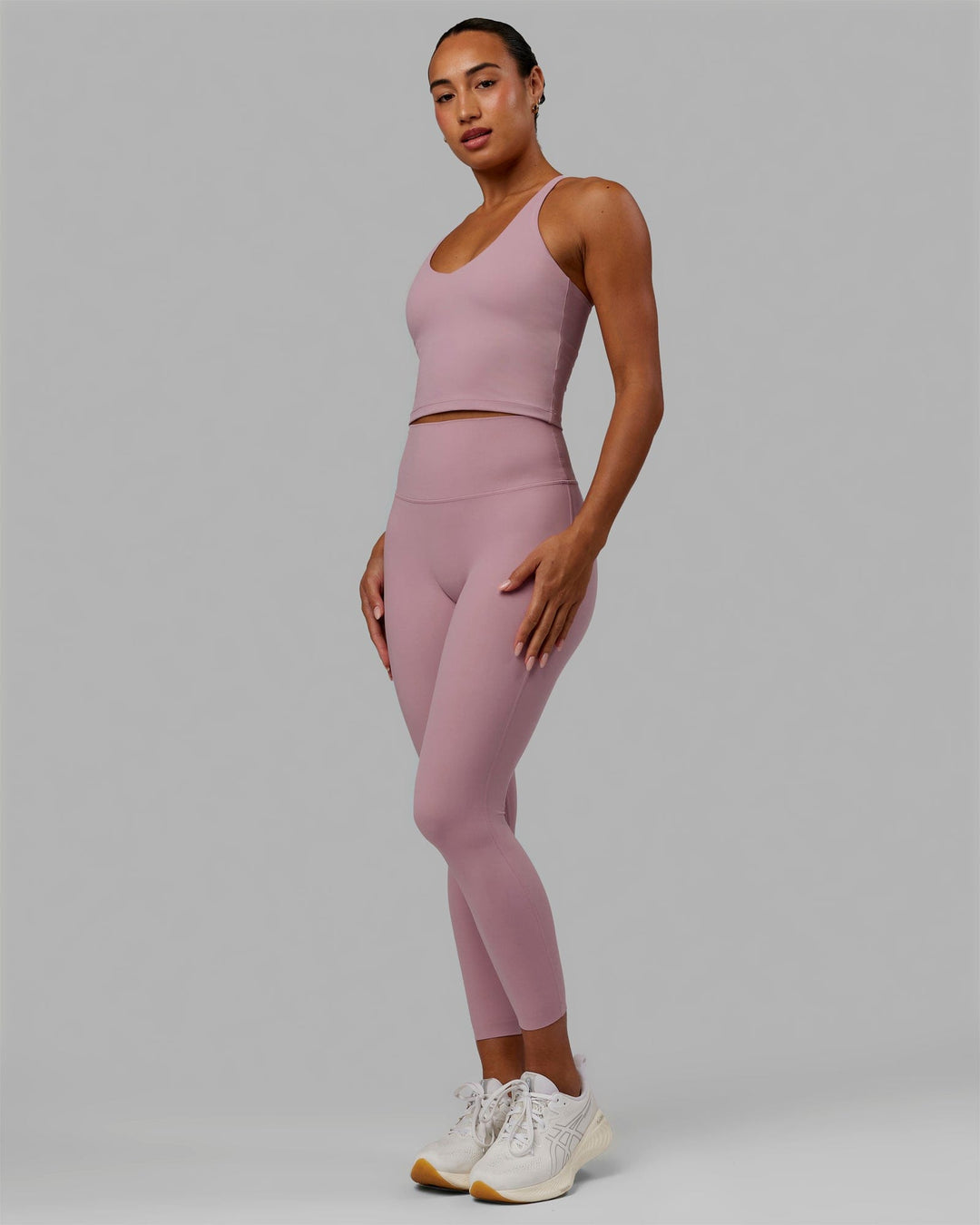 Woman wearing Elixir 7/8 Length Tights - Cosmetic Pink
