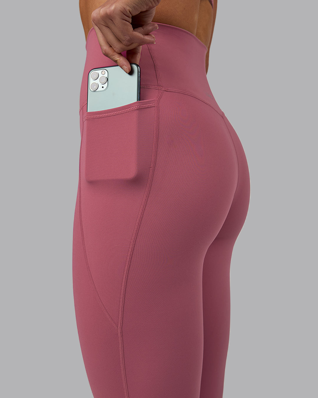Woman wearing Elixir Ultra High-Rise 7/8 Legging Pockets - Mauve Haze | Model:Shae | Size:S