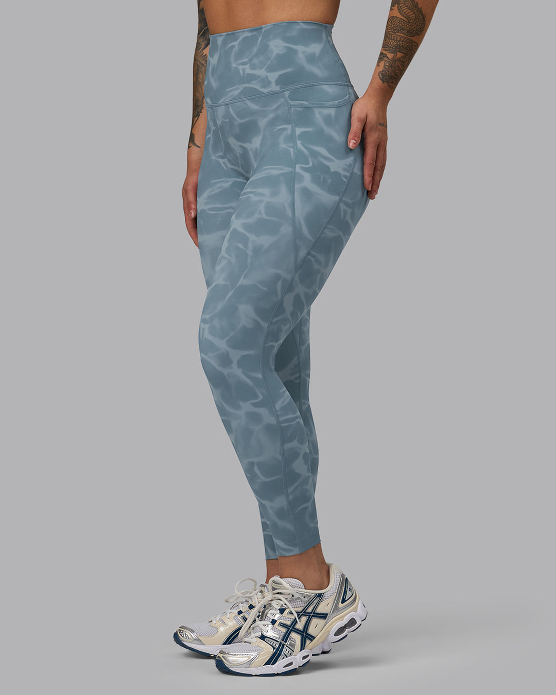 Woman wearing Elixir Ultra High-Rise 7/8 Legging Pockets - Tranquil-Elemental Blue | Model:Robyn | Size:S
