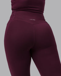 Woman wearing Elixir Ultra High-Rise 7/8 Legging Pockets - Cherry Lacquer | Model:Lyss | Size:S