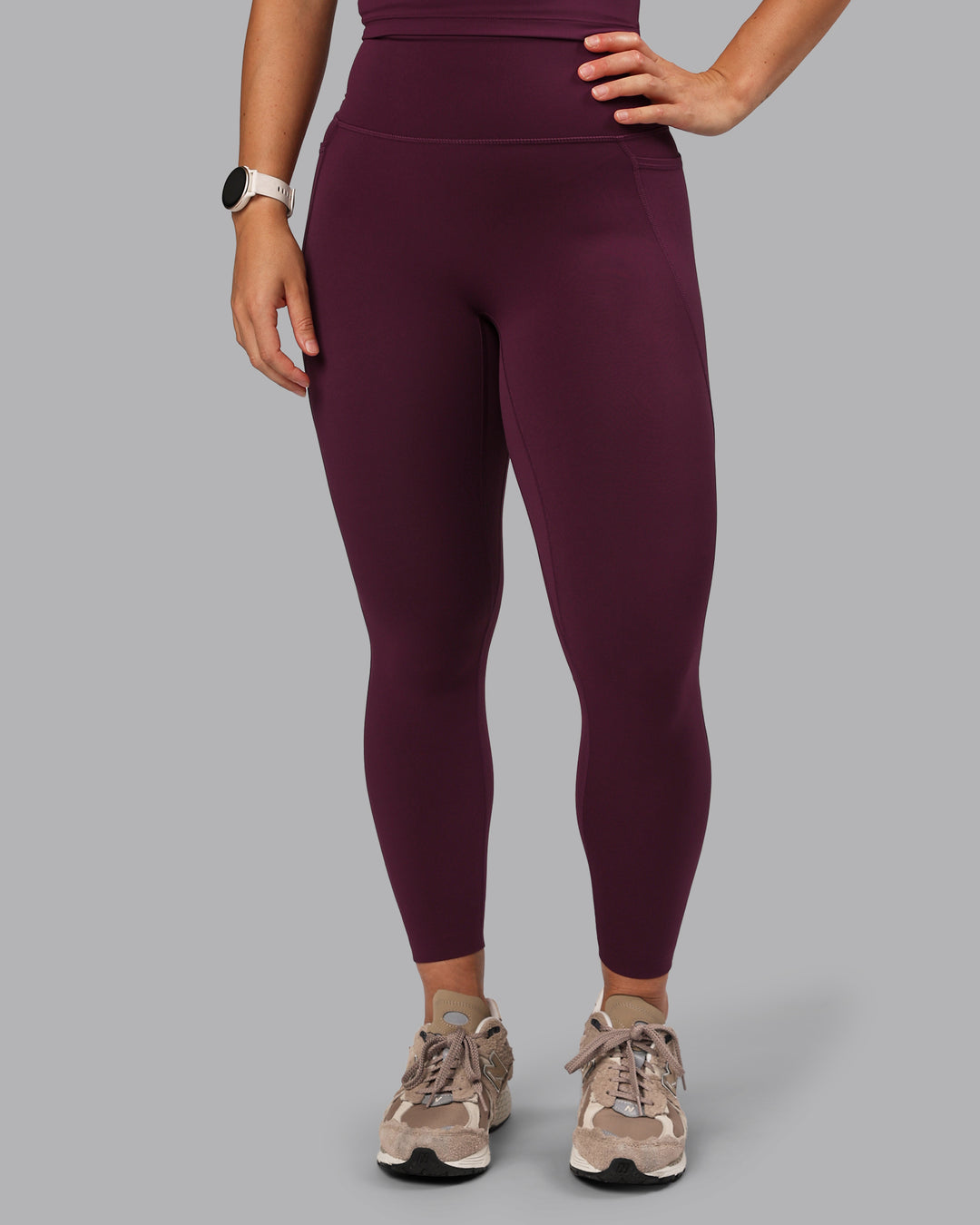 Woman wearing Elixir Ultra High-Rise 7/8 Legging Pockets - Cherry Lacquer | Model:Lyss | Size:S