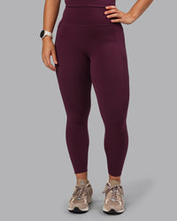 Woman wearing Elixir Ultra High-Rise 7/8 Legging Pockets - Cherry Lacquer | Model:Lyss | Size:S