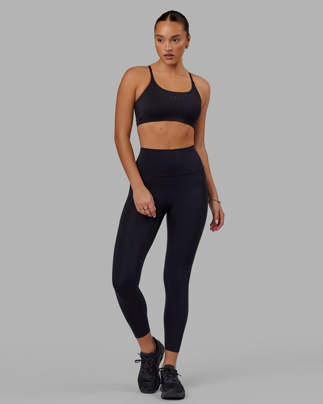 Woman wearing Elixir 7/8 Tights With Pockets - Black