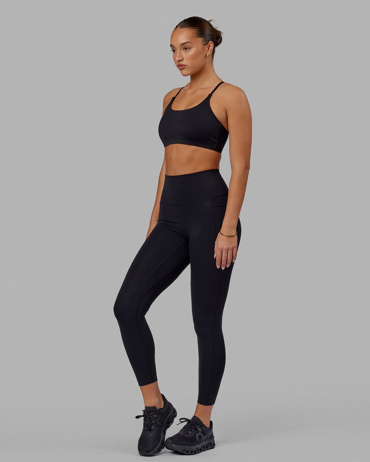 Woman wearing Elixir 7/8 Tights With Pockets - Black