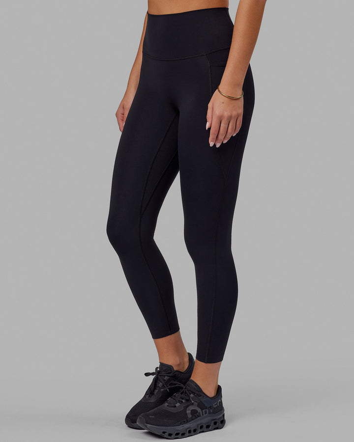 Woman wearing Elixir 7/8 Tights With Pockets - Black