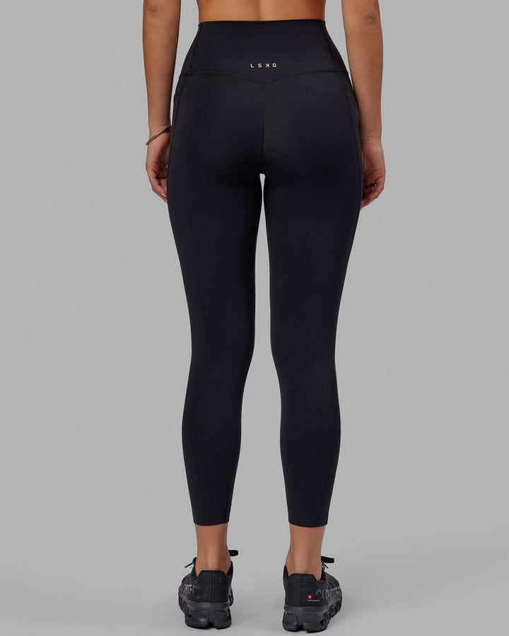 Woman wearing Elixir 7/8 Tights With Pockets - Black
