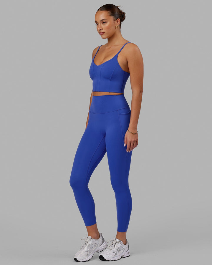 Woman wearing Elixir 7/8 Tights With Pockets - Power Cobalt