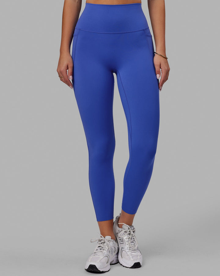 Woman wearing Elixir 7/8 Tights With Pockets - Power Cobalt