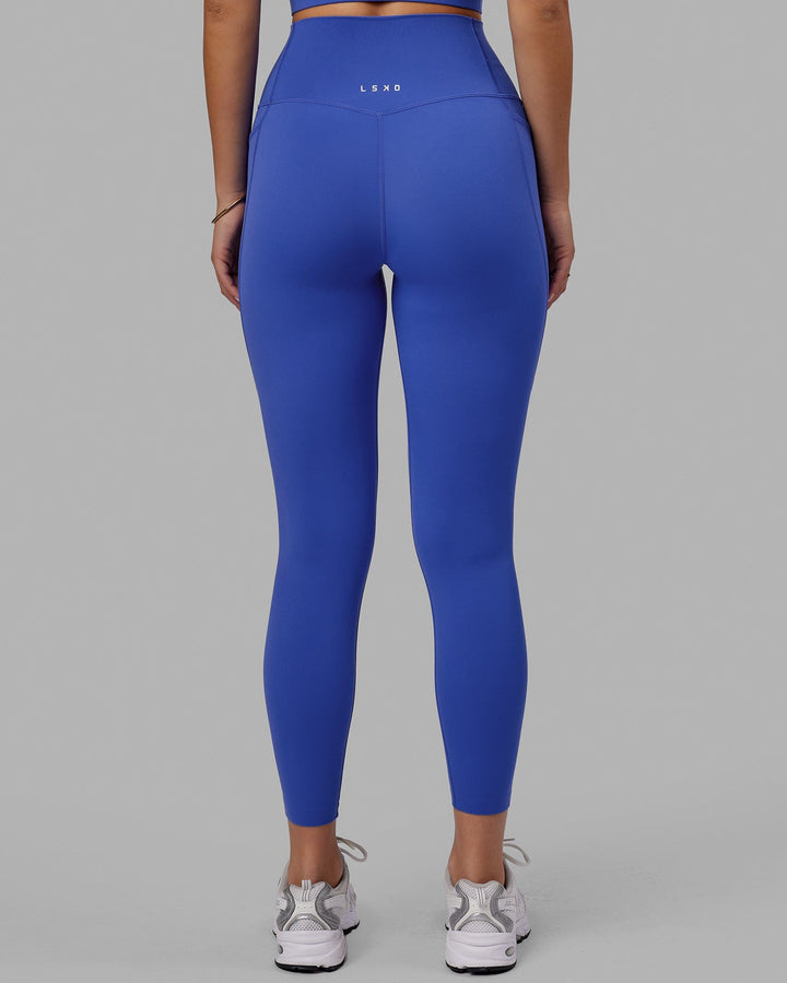 Woman wearing Elixir 7/8 Tights With Pockets - Power Cobalt