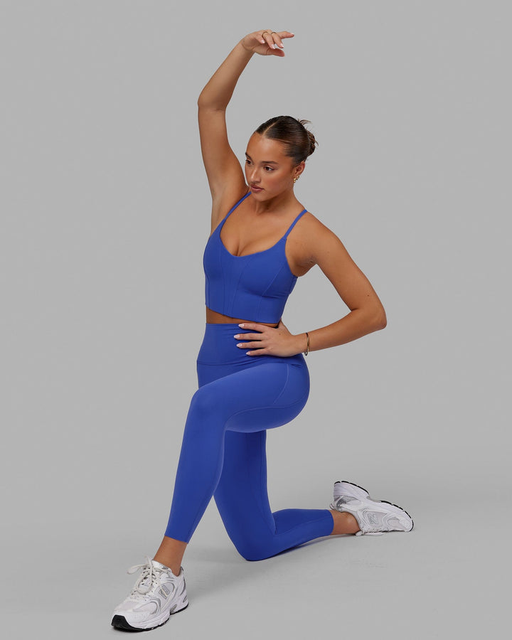 Woman wearing Elixir 7/8 Tights With Pockets - Power Cobalt