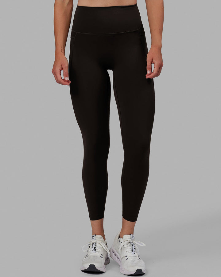Woman wearing Elixir 7/8 Length Tights With Pockets - Dark Walnut