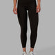 Woman wearing Elixir 7/8 Length Tights With Pockets - Dark Walnut