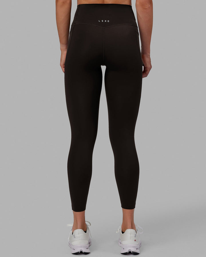Woman wearing Elixir 7/8 Length Tights With Pockets - Dark Walnut