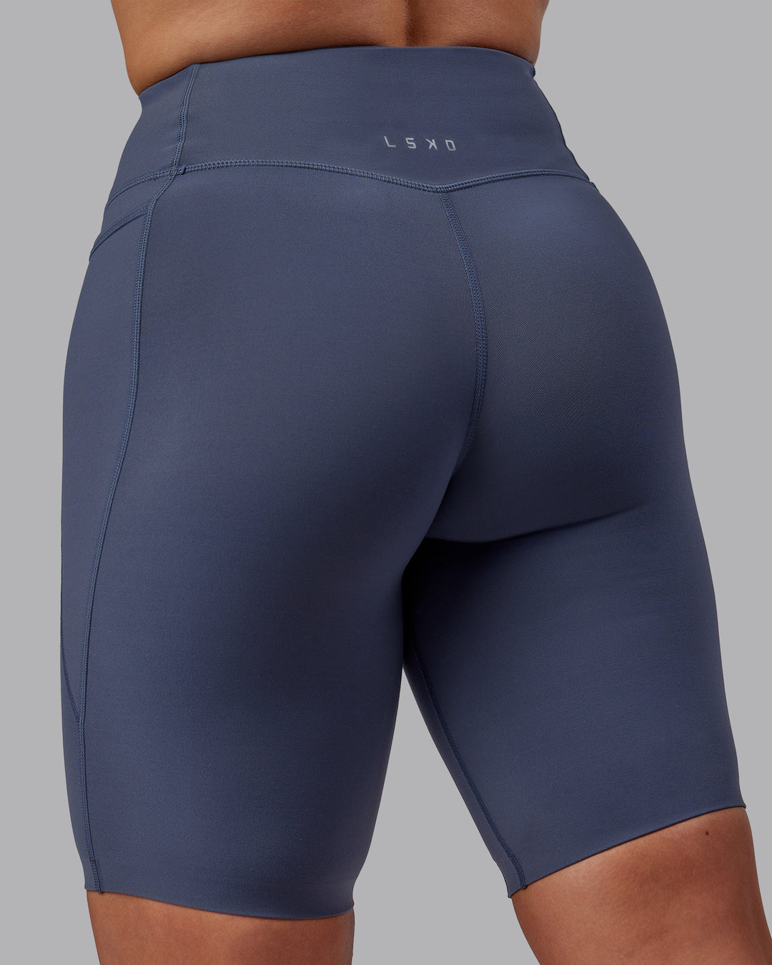Woman wearing Elixir Ultra High-Rise 9&quot; Short Pockets - Turbulence | Model:Suz | Size:S