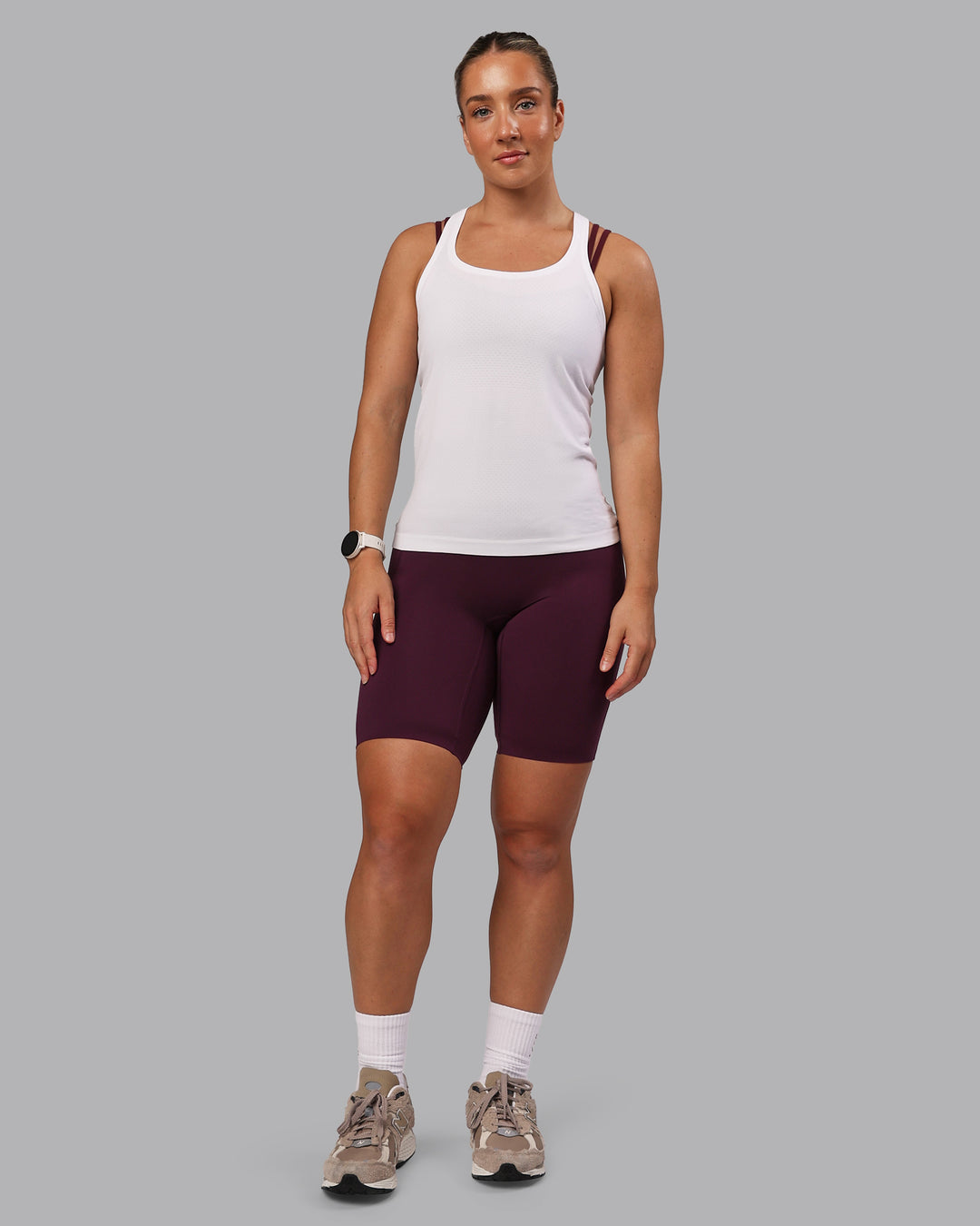 Woman wearing Elixir Ultra High-Rise 9&quot; Short Pockets - Cherry Lacquer | Model:Lyss | Size:S