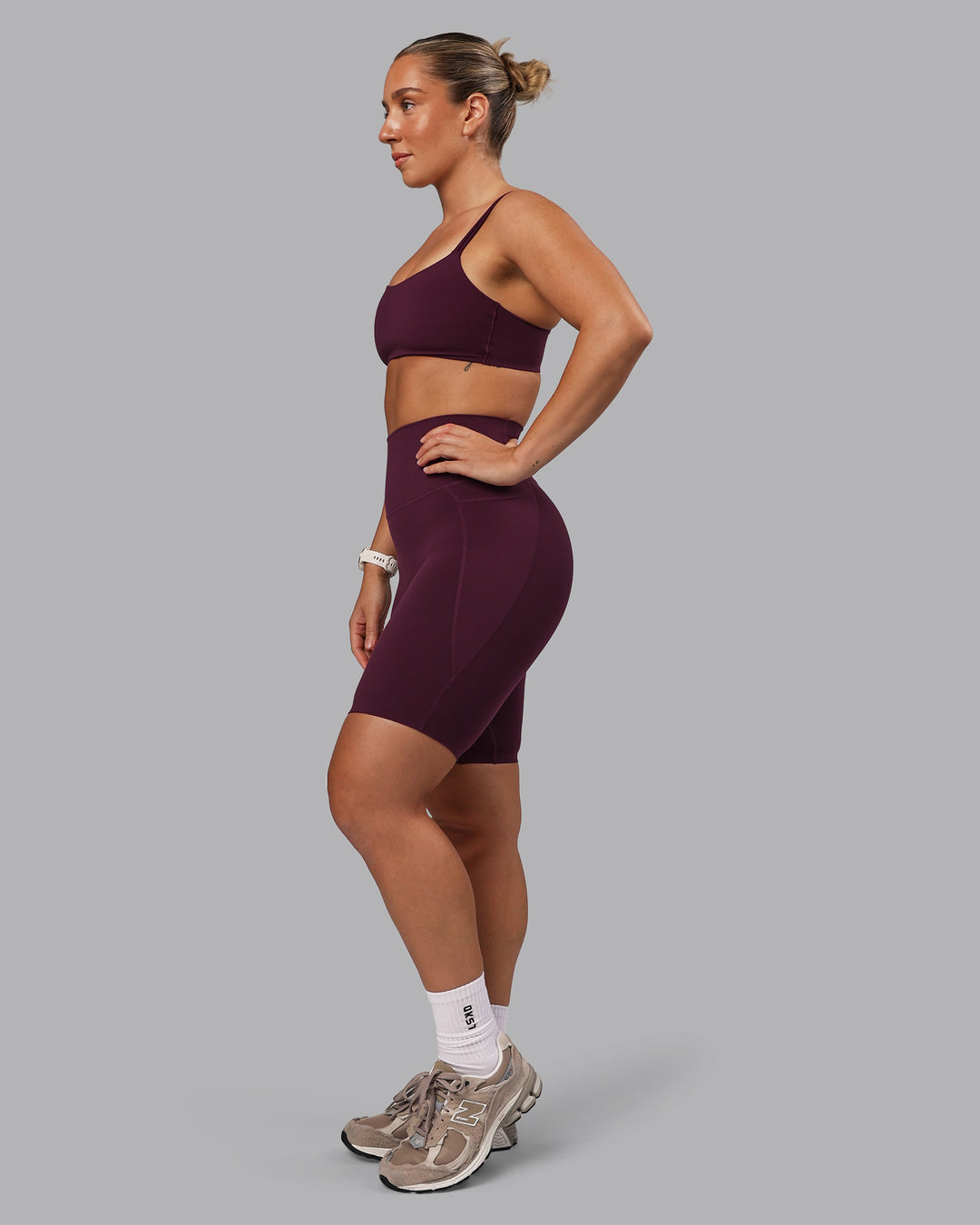 Woman wearing Elixir Ultra High-Rise 9&quot; Short Pockets - Cherry Lacquer | Model:Lyss | Size:S