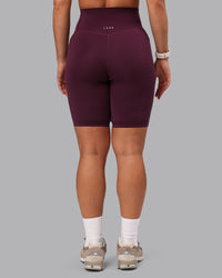 Woman wearing Elixir Ultra High-Rise 9" Short Pockets - Cherry Lacquer | Model:Lyss | Size:S
