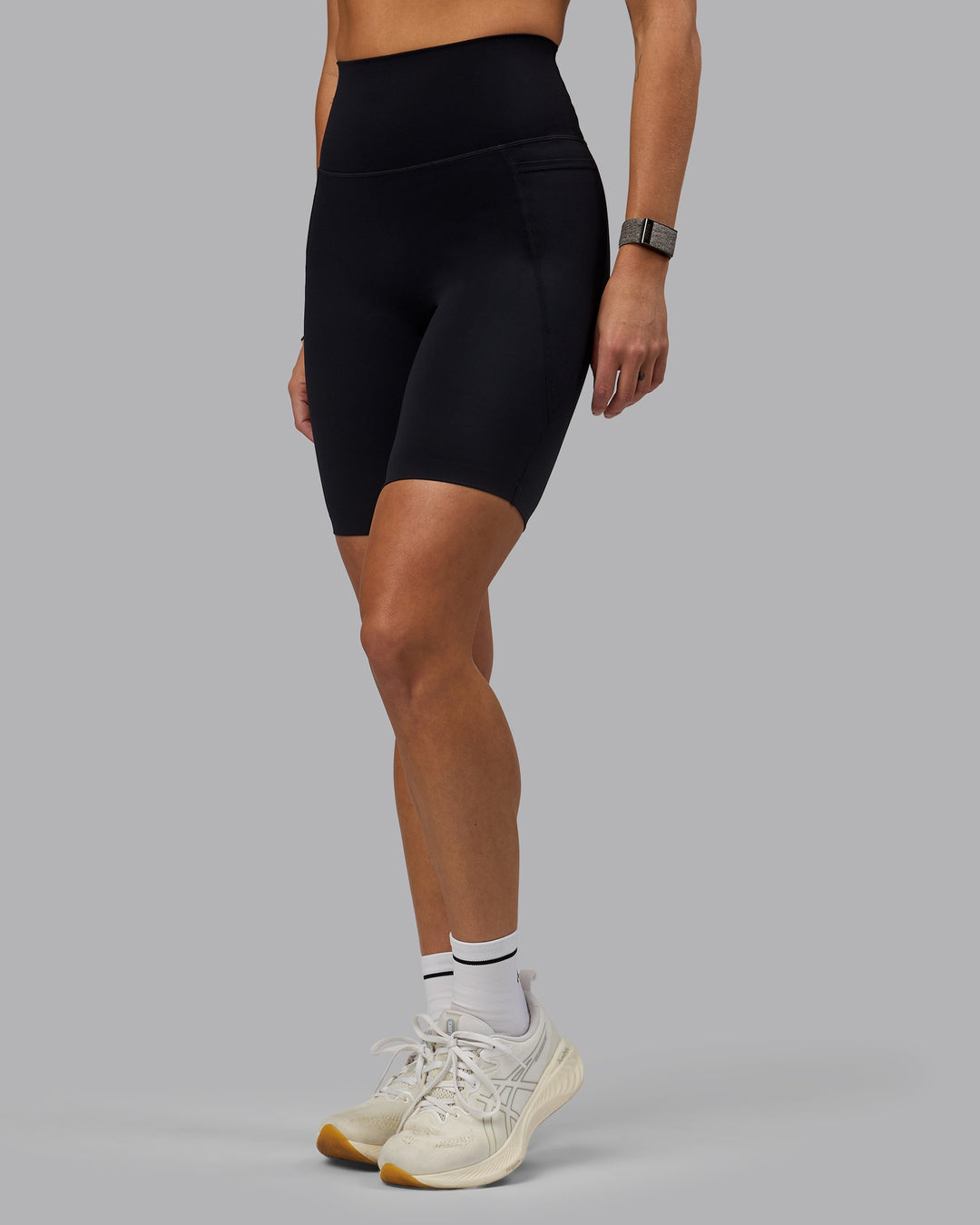 Woman wearing Elixir Ultra High-Rise 9&quot; Short Pockets - Black | Model:Shae | Size:S
