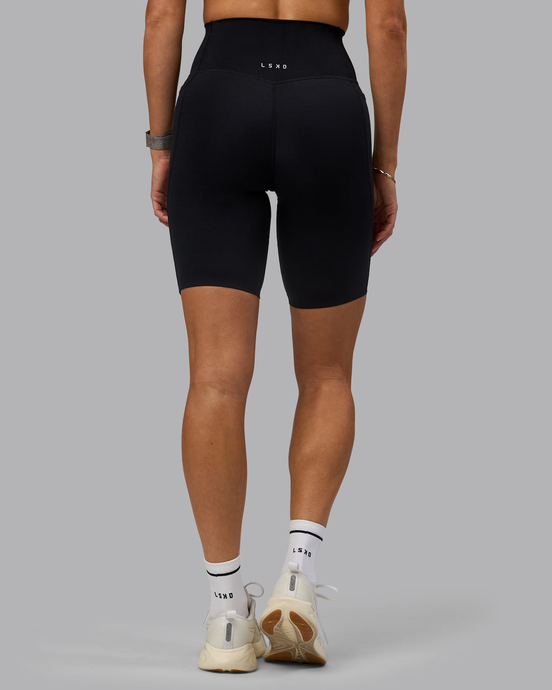 Woman wearing Elixir Ultra High-Rise 9&quot; Short Pockets - Black | Model:Shae | Size:S