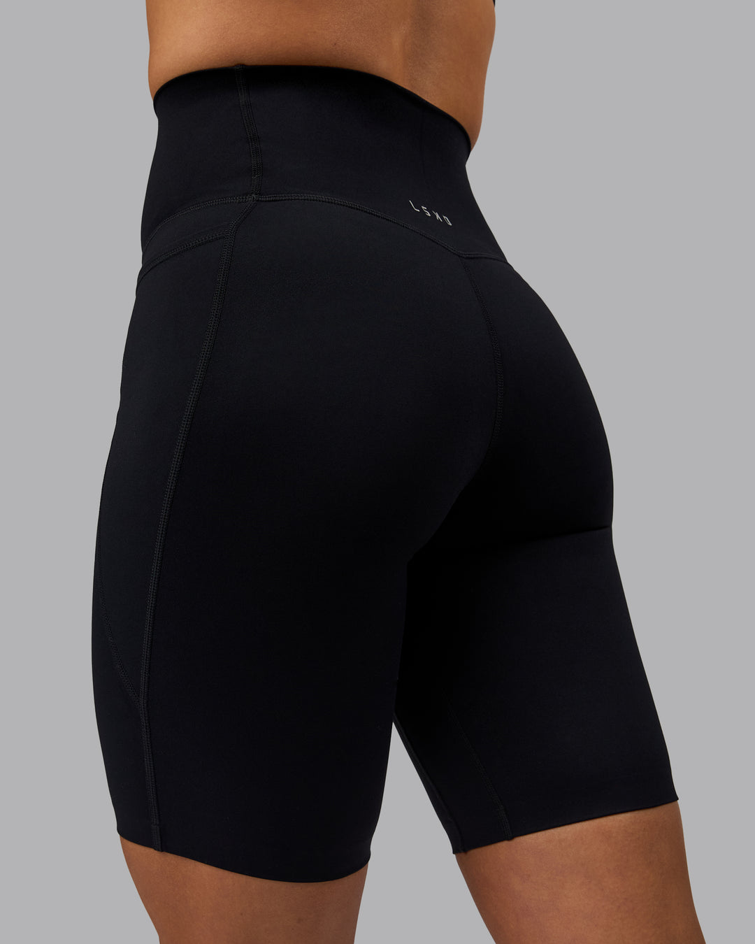 Woman wearing Elixir Ultra High-Rise 9&quot; Short Pockets - Black | Model:Shae | Size:S
