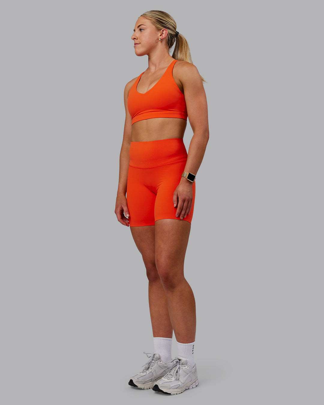 Woman wearing Elixir Ultra High-Rise Bonded Waistband 6&quot; Short - Grenadine | Model:Caitlin | Size:S