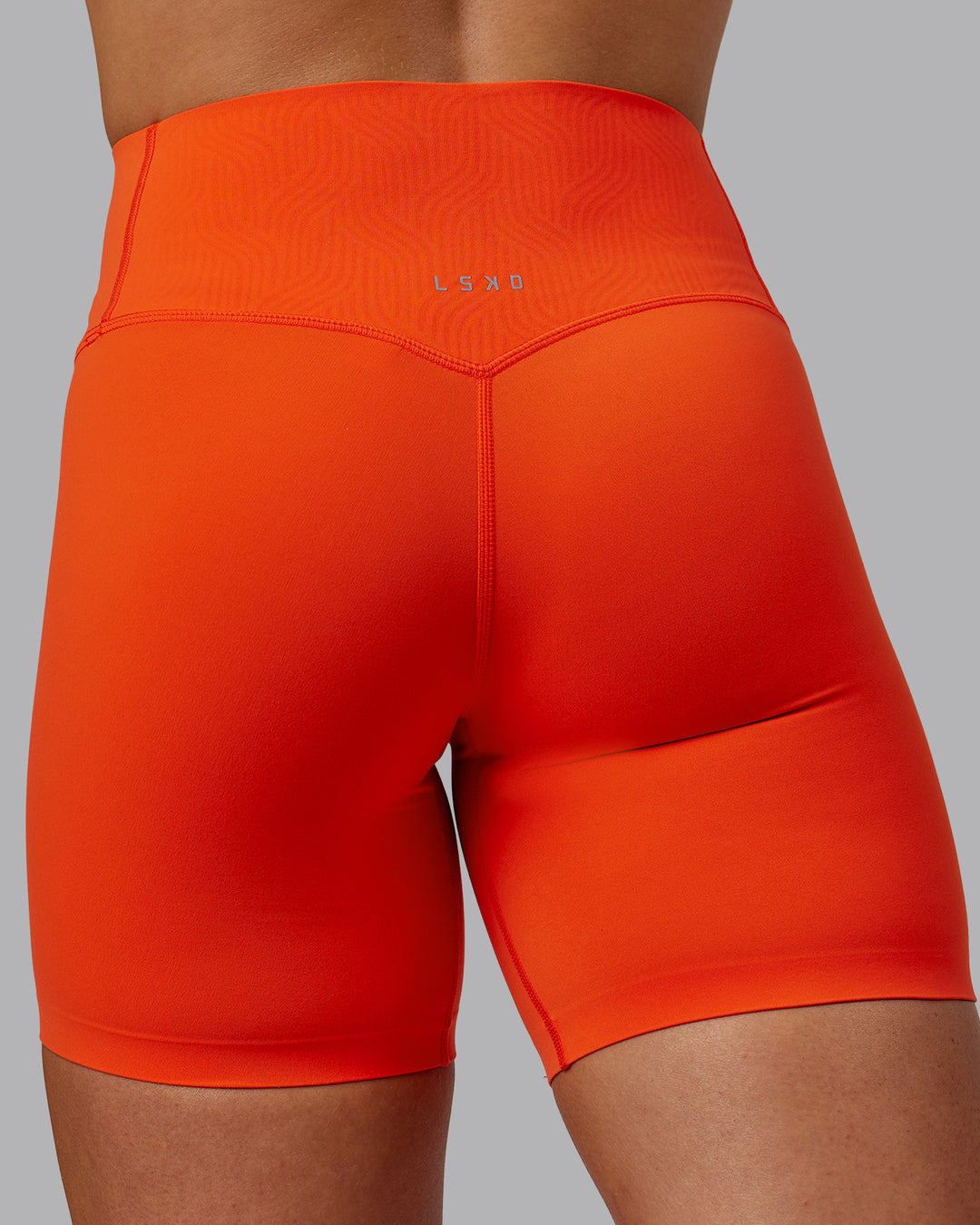 Woman wearing Elixir Ultra High-Rise Bonded Waistband 6&quot; Short - Grenadine | Model:Caitlin | Size:S