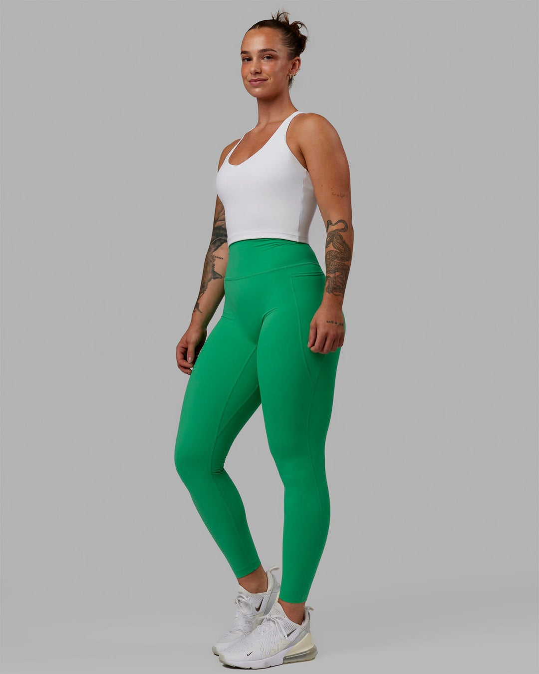 Woman wearing Elixir Ultra High-Rise Full Length Legging Pockets - Holly Green