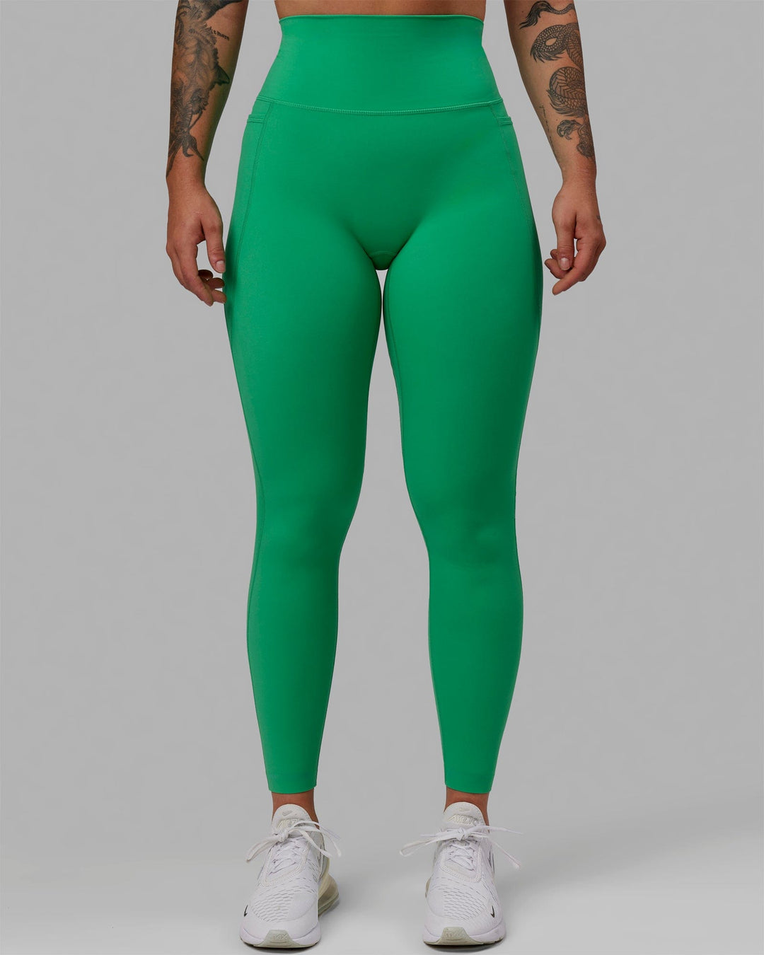 Woman wearing Elixir Ultra High-Rise Full Length Legging Pockets - Holly Green