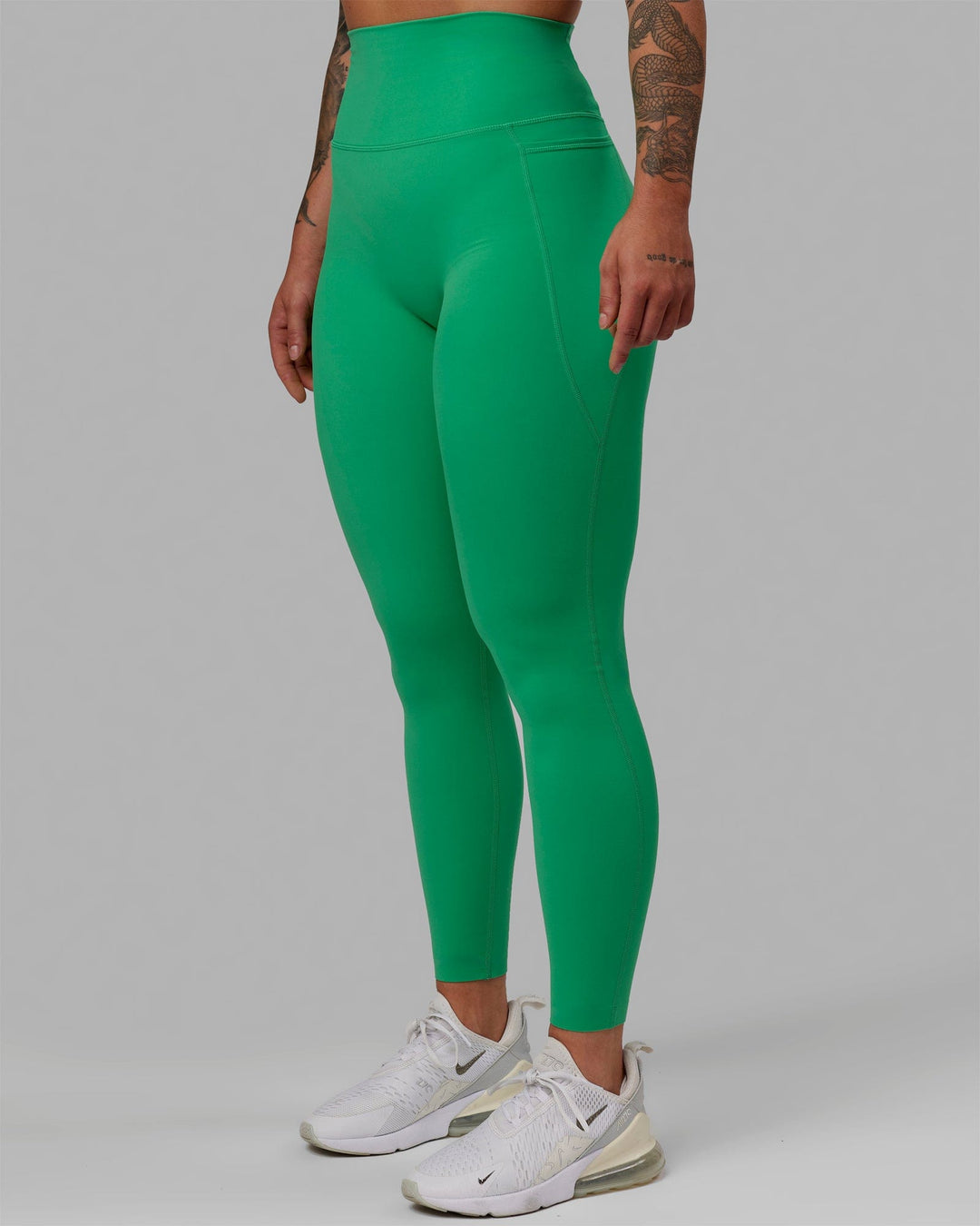 Woman wearing Elixir Ultra High-Rise Full Length Legging Pockets - Holly Green