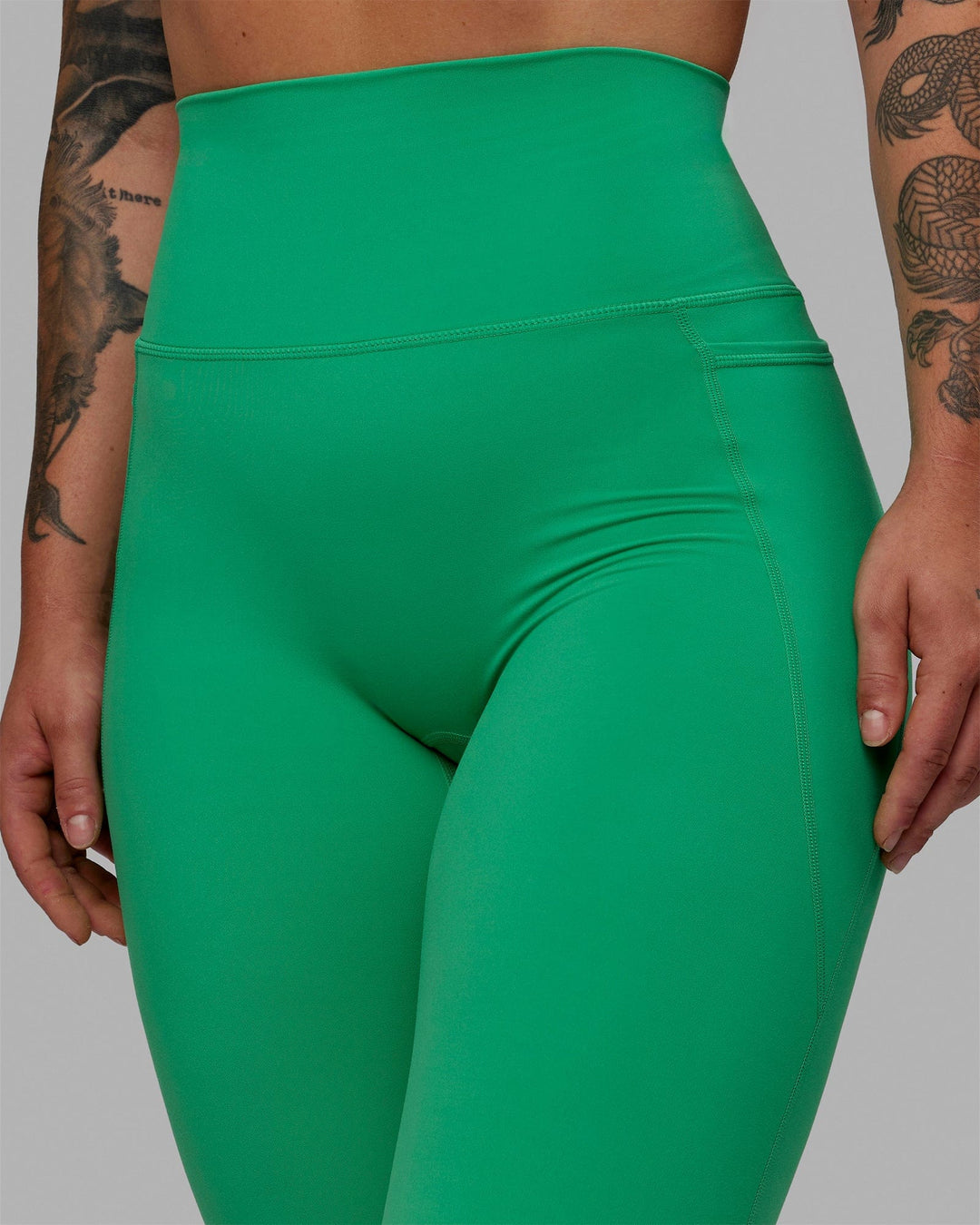 Woman wearing Elixir Ultra High-Rise Full Length Legging Pockets - Holly Green