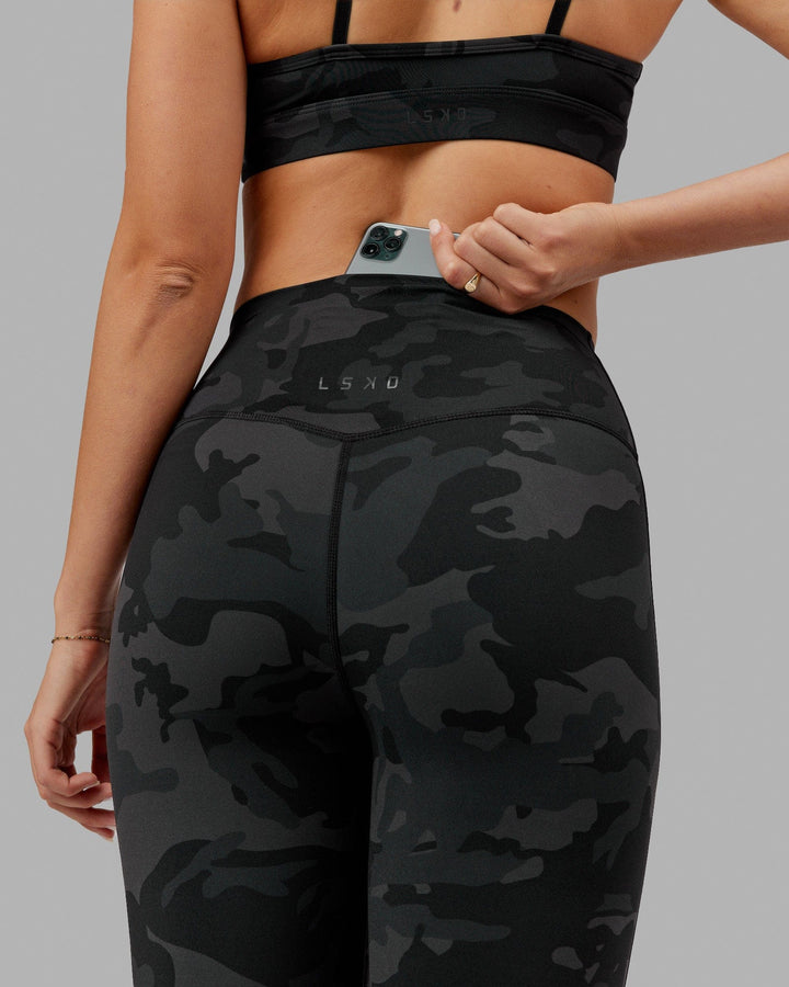 Woman wearing Elixir Full Length Tight - Black Camo
