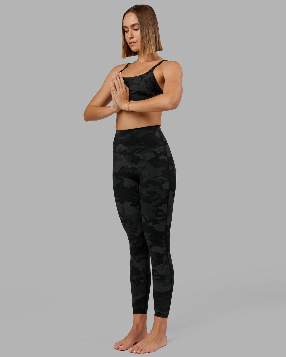 Woman wearing Elixir Full Length Tight - Black Camo