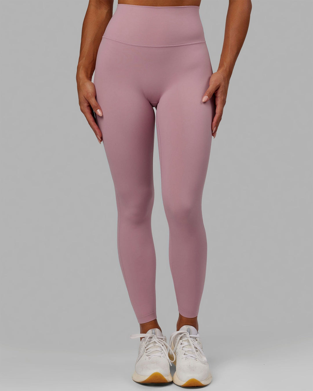 Woman wearing Elixir Full Length Tights - Cosmetic Pink