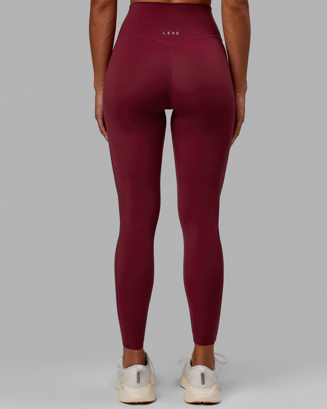Woman wearing Elixir Full Length Tights - Cranberry