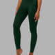 Woman wearing Elixir Full Length Tight - Ivy Green