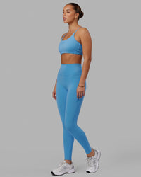 Woman wearing Elixir Ultra High-Rise Full Length Legging Pockets - Azure Blue