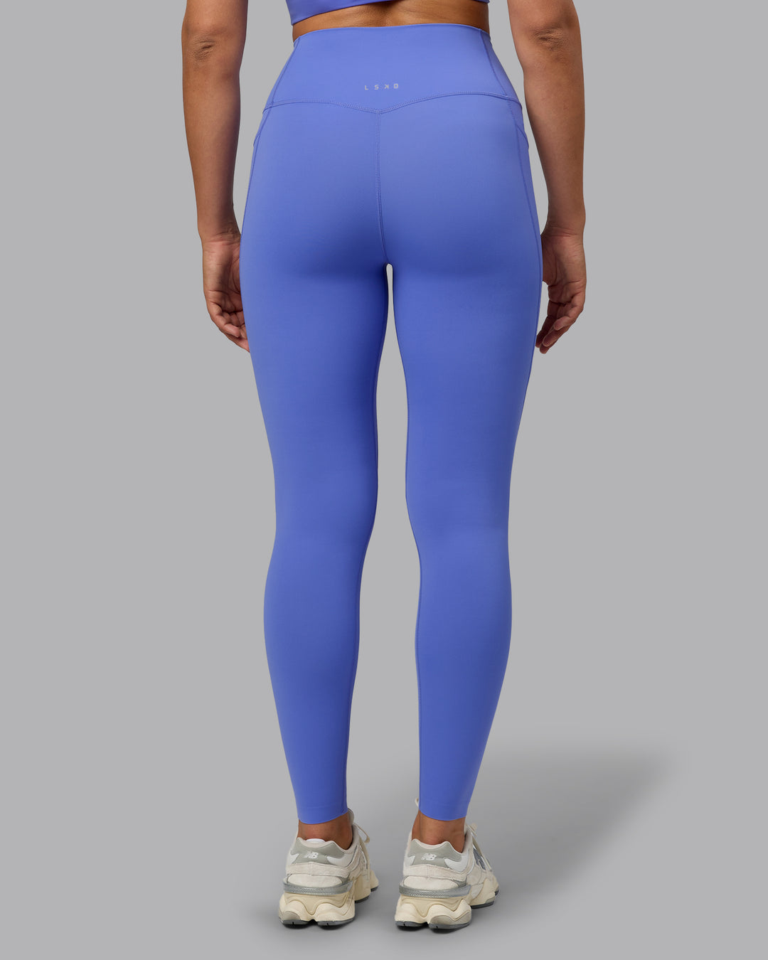 Woman wearing Elixir Ultra High-Rise Full Length Legging Pockets - Baja Blue