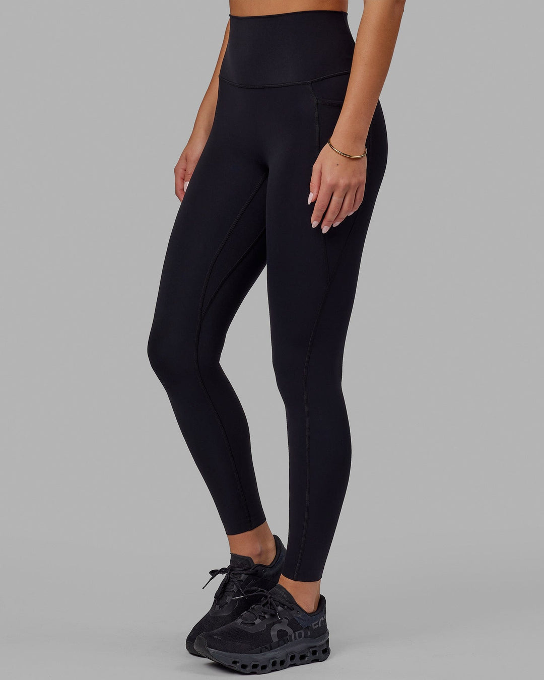 Woman wearing Elixir Full Length Tight With Pockets - Black