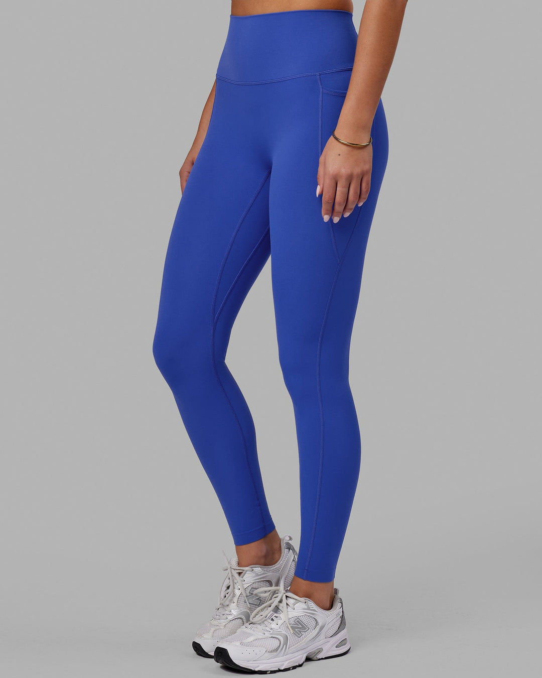 Woman wearing Elixir Ultra High-Rise Full Length Legging Pockets - Power Cobalt