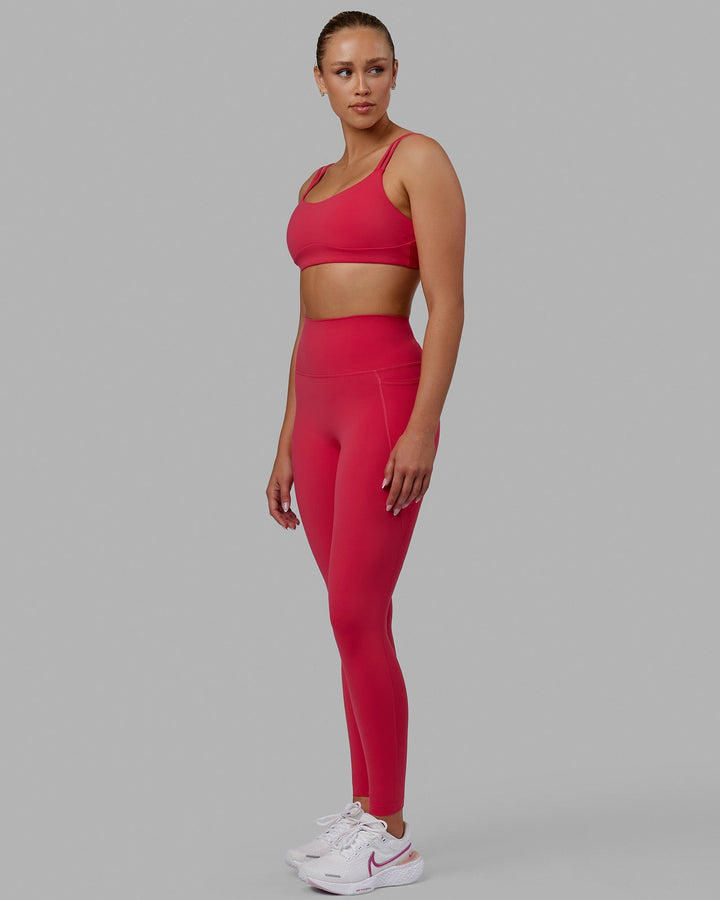 Woman wearing Elixir Full Length Tights With Pockets - Raspberry