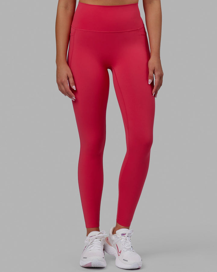 Woman wearing Elixir Full Length Tights With Pockets - Raspberry