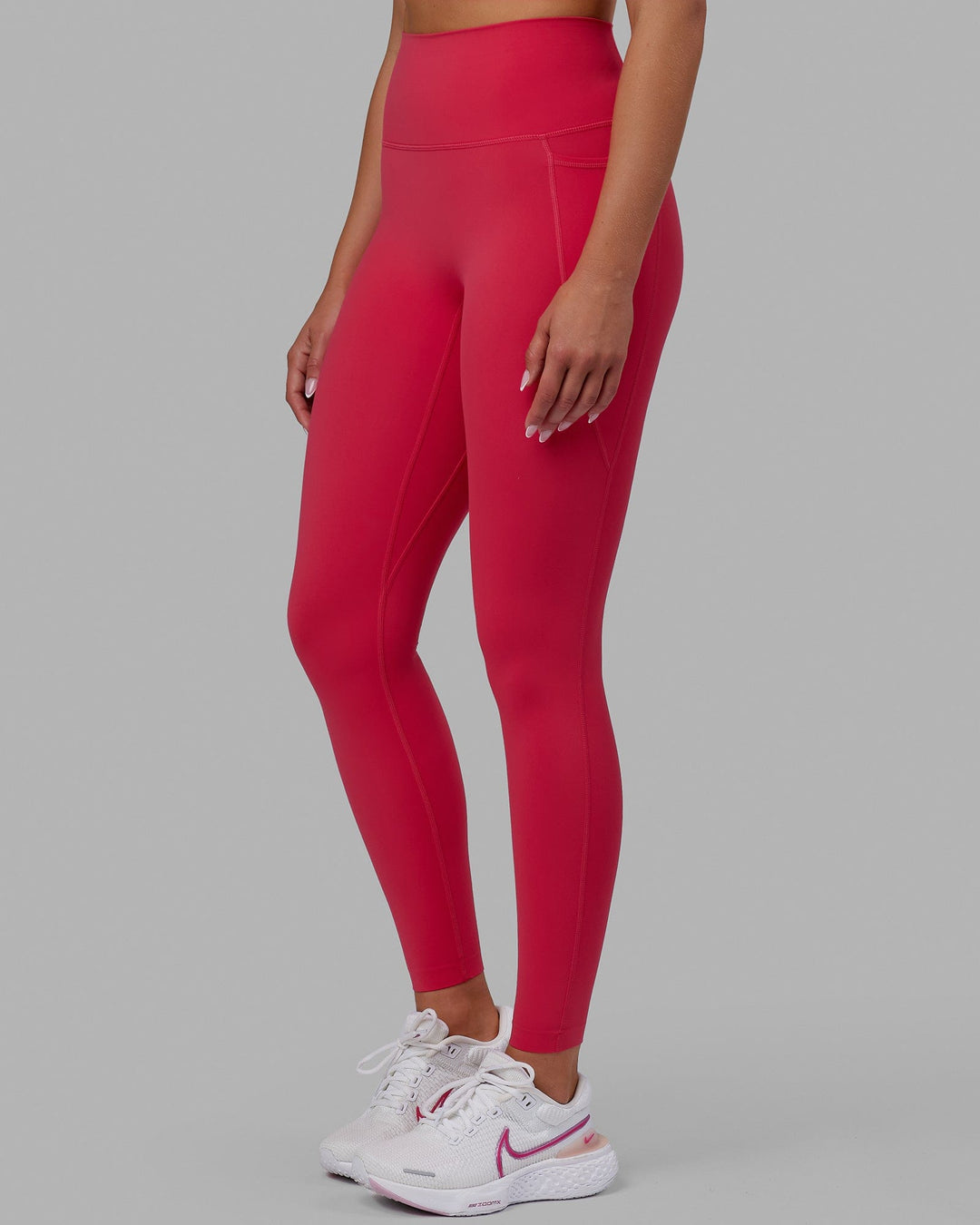 Woman wearing Elixir Full Length Tights With Pockets - Raspberry