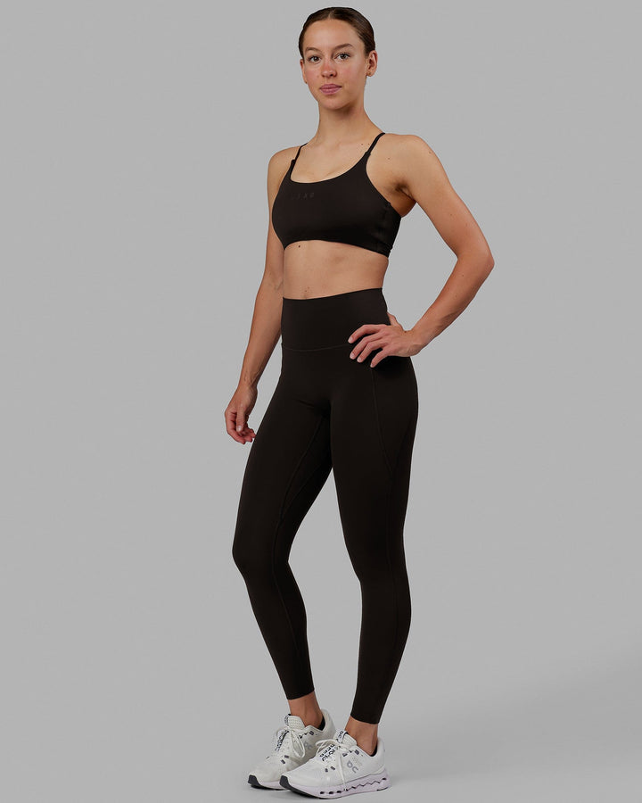 Woman wearing Elixir Full Length Tights With Pockets - Dark Walnut